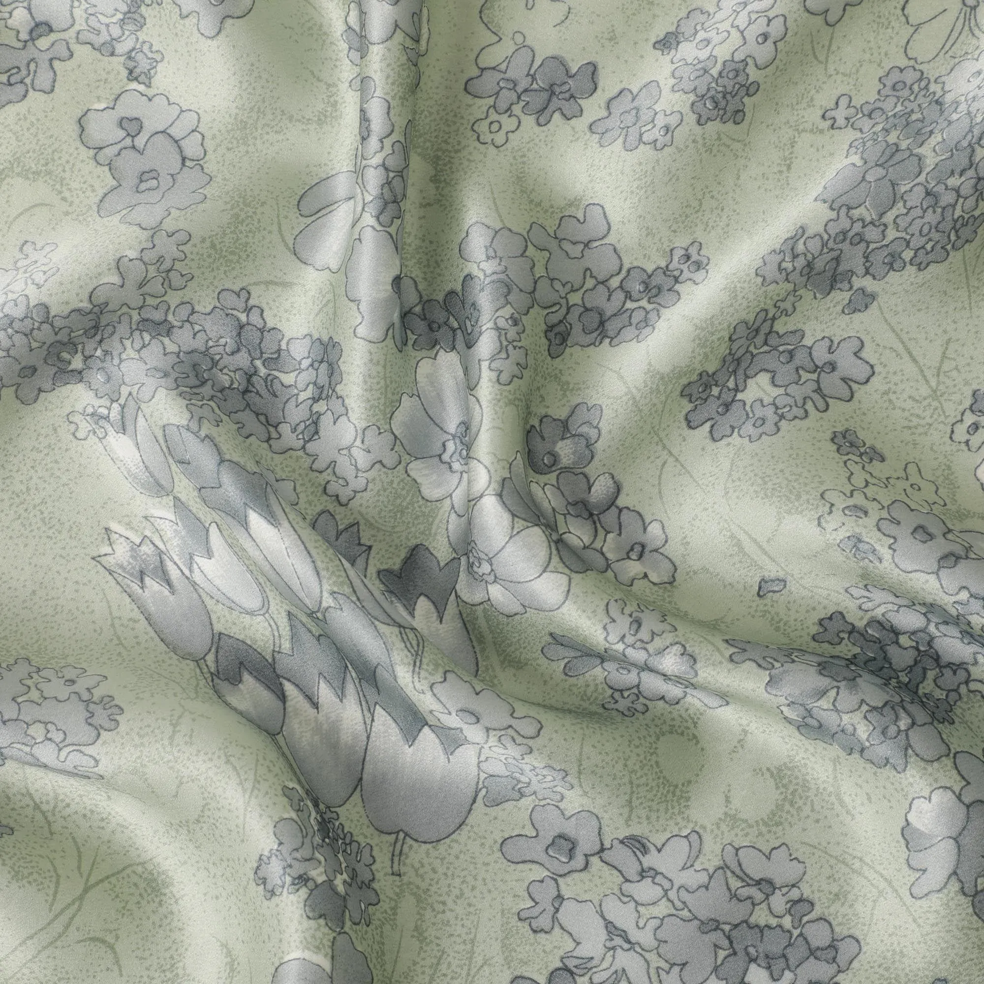 Laurel green silk satin fabric with smoke grey and black print in floral design